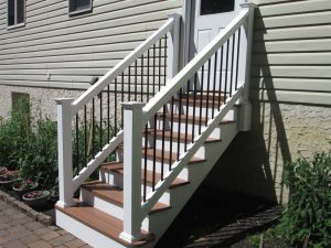 A Trex back door staircase with white vinyl railing built on a home in Perkasie, PA.