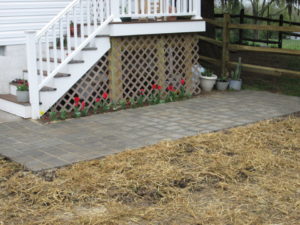 A Trex deck with paver patio built on  a home in Perkasie, PA.