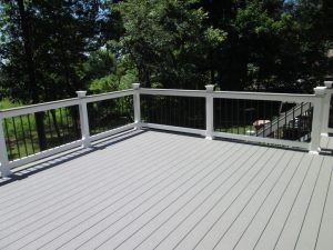 A Trex Select "Pebble Stone" deck with cocktail railing built on a home in Milford Square, PA.