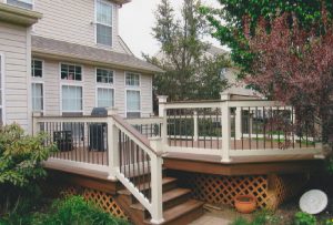 A Trex Spiced Rum Deck and cocktail railing with bronze balusters on a project we built in Perkasie, PA.