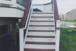 White LED riser lights on the stairs of a deck we built in Dublin, PA.