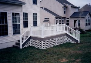 A Trex Deck; Select Winchester Grey material with a white vinyl lattice and railing built in Doylestown, PA.