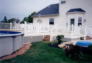 A Trex deck around an above ground pool with turned Colonial balusters