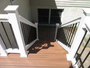 A Trex "Tiki Torch" deck with a T-railing and tubular balusters built on a home in Perkasie, PA