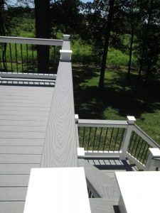 A Trex Select "Pebble Stone" deck with cocktail railing and black metal spindles located in Milford Square, PA.