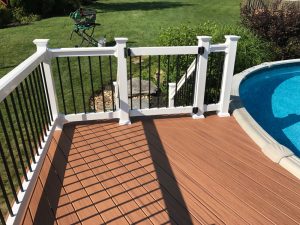 Vinyl pool gate with locking hardware and spring loaded hinges for safety in Coopersburg, PA.