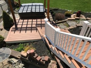Coopersburg, PA Trex Transcends deck project (Tiki Torch) with stairs and landing to enter hot tub area