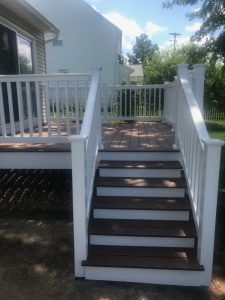 Trex Select deck (Saddle) with vinyl T-railing built in Trumbauersville, PA.