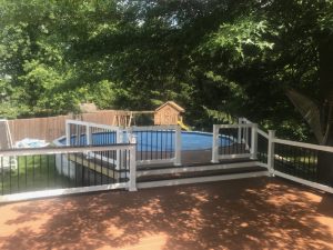 A Trex Transcends Deck providing an entry to the pool with two tone decking . This project was built in Quakertown, PA.