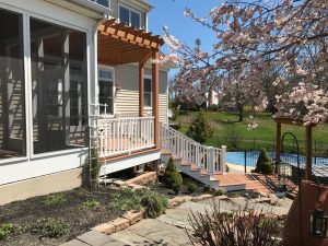 Composite Deck, Trex Transcends "Tiki Torch" with white vinyl railings with screened porch and pergola in  Coopersburg, PA.