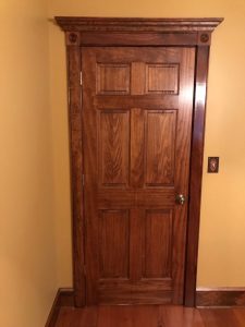 We installed an interior six panel stained door with custom trim for a client in Pleasant Valley.