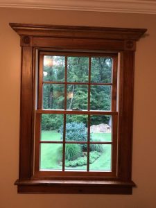 We installed this A stained window with custom trim and rosettes in Pleasant Valley, PA.