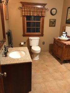 We remodeled this bathroom with antique features and ceramic tile.