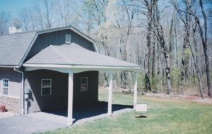We built this car port with  a hip roof on a home in Quakertown, PA.