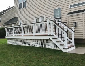 A Trex deck with cocktail rail and two-tone decking we built on a home in Dublin, PA.