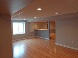 A basement renovation with a TV room and an adjoining game room in a Plumsteadville home.