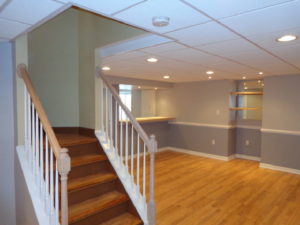 A home in Plumsteadville with a finished basement-game room and stairway with an oak banister.