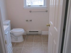 This bathroom renovation included a tile flooring, new toilet, sink and bath tub on a home located in Silverdale, PA.