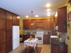 Kitchen Remodel - Cherry cabinets with granite counter top with tumble marble back splash with ceramic tile floor in Quakertown PA.