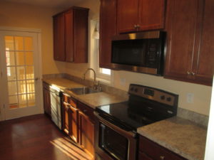 Kitchen Remodel - Maple cabinets with formica counter top with hardwood flooring in Perkasie, PA.