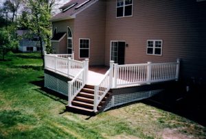 A TimberTech deck with colonial white vinyl railing we built in Warrington , PA.