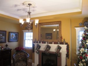 We built this living room mantel with crown molding ceiling on this home in Quakertown, PA.