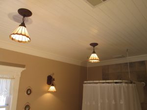A beaded board bathroom ceiling with custom crown molding located in Quakertown, PA.