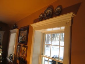A deep sill windows with crown molding and rosettes on a home in Quakertown, PA.