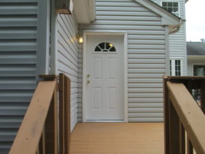 In Quakertown we installed a replacement door with four panels and a half round window.
