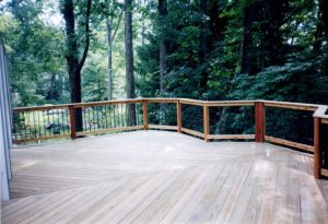 An image of cedar deck, herring-bone style with black tubular balusters we built in Center Valley, PA.