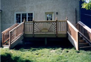 A Cedar deck with decorative sunbursts built on a home in New Hope, PA.