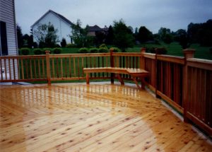 Cedar deck with herring bone style decking with built in benches located in Trumbaursville PA