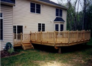 A photo of a pressure treated deck with custom railing and gate we built in Springtown, PA.