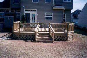 A pressure treated deck with sunbursts and lattice built in Plumsteadville, PA.