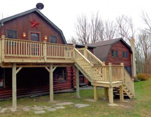 A pressure treated deck with stairs and landing located in Upper Black Eddy PA
