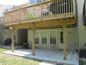 This second story pressure treated deck with standard railing was built in Center Valley, PA.