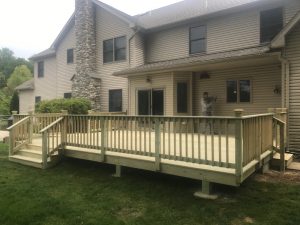 A pressure treated deck project with decorative post caps located in Lower Sucon Valley PA