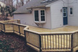 A pressure treated deck project with standard railing built in Doylestown, PA.